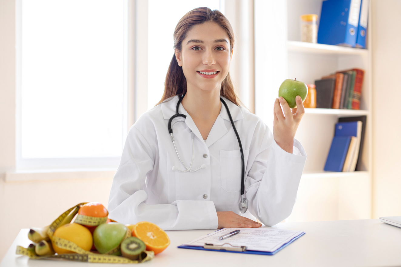 Female dietician showing